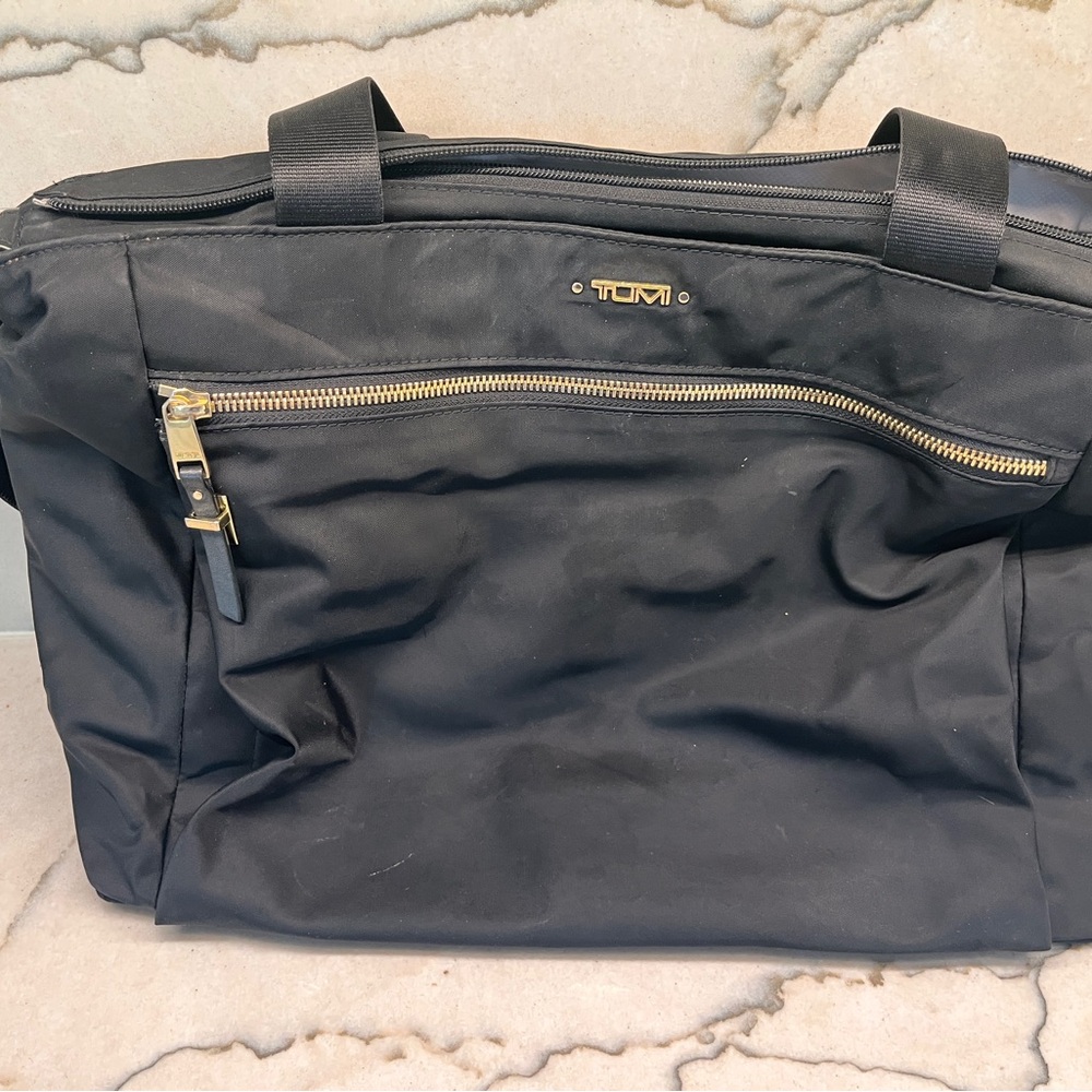TUMI Black Briefcase with Gold Accents